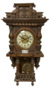 German oak cased 8-day striking wall clock c1910.
