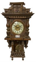 German oak cased 8-day striking wall clock c1910.