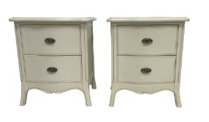 Pair of French design cream finish serpentine bedside pedestal chests