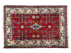 Persian crimson ground rug