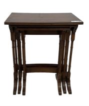 Early 20th century yew wood nest of three tables