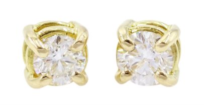 Pair of 18ct gold single stone round brilliant cut diamond stud earrings