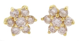Pair of gold round brilliant cut diamond cluster earrings