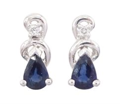 Pair of 14ct white gold pear cut sapphire and diamond stud earrings