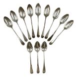 Set of twelve George III Celtic Point pattern silver table spoons engraved with a crescent shape cre