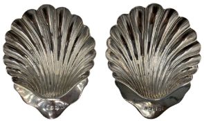 Pair of silver shell pattern butter dishes
