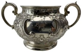 Victorian silver two handled sugar bowl with embossed decoration