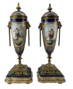 Pair of 19th century Sevres style porcelain and gilt metal urns and covers