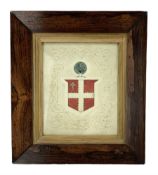 19th century embossed pressed paper crest heightened with watercolour with a quartered shield surmou