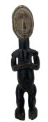 West African carved hardwood male tribal figure in crouching pose