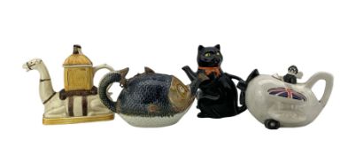 Four novelty teapots comprising a Victorian majolica novelty teapot and cover
