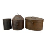 Three 19th century toleware hat and helmet boxes