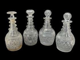 Pair of Georgian Prussian bodied triple ring neck decanters with slice and diamond cut decoration