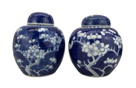 Matched pair of Chinese Prunus pattern ginger jars and covers