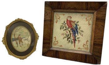 19th century woolwork picture depicting a parrot perched on a branch