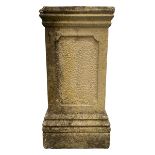 Weathered cast stone pedestal of rectangular form