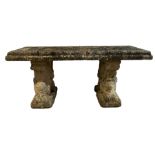 Three-piece weathered cast stone garden bench