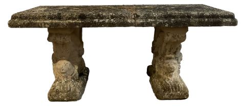 Three-piece weathered cast stone garden bench