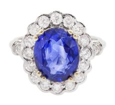 18ct white gold oval cut sapphire and round brilliant cut diamond cluster ring