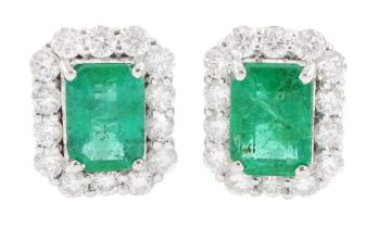 Pair of 18ct white gold octagonal cut emerald and round brilliant cut diamond cluster stud earrings