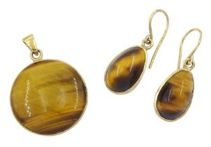 Pair of gold tiger's eye pendant and a similar pair of gold pendant earrings