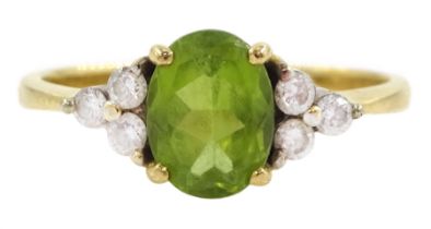 18ct gold oval cut peridot and six stone round brilliant cut diamond ring