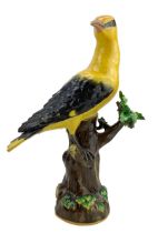 Late 19th/ early 20th century Meissen porcelain figure of a Golden Oriole perchen on a tree stump