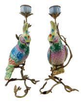 Pair of ceramic and bronzed metal candlesticks modelled as a Parrot perched upon a flowering branch