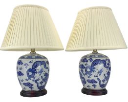 Pair of blue and white ovoid form table lamps