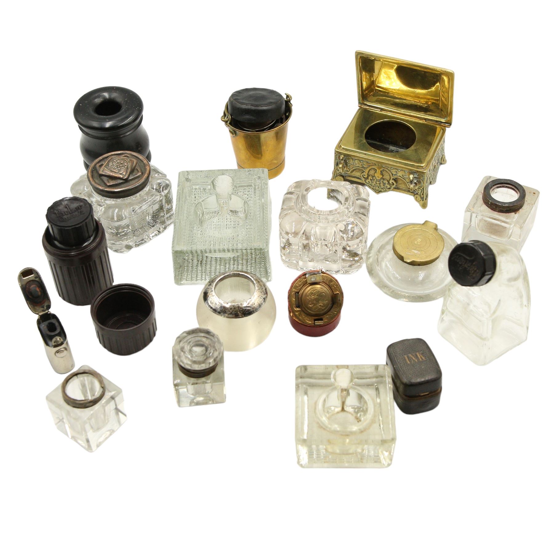 Victorian and later inkwells to include a brass casket form inkwell with hinged cover