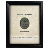 Framed Wurlitzer Presents The Proudest Product in 100 Years Advertisement