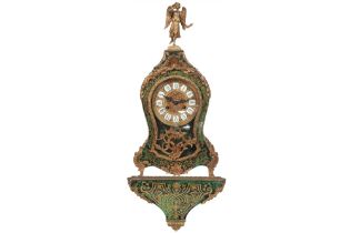 Louis XV style clock with its console in "Boulle" with so-called "green tortoiseshell" and with