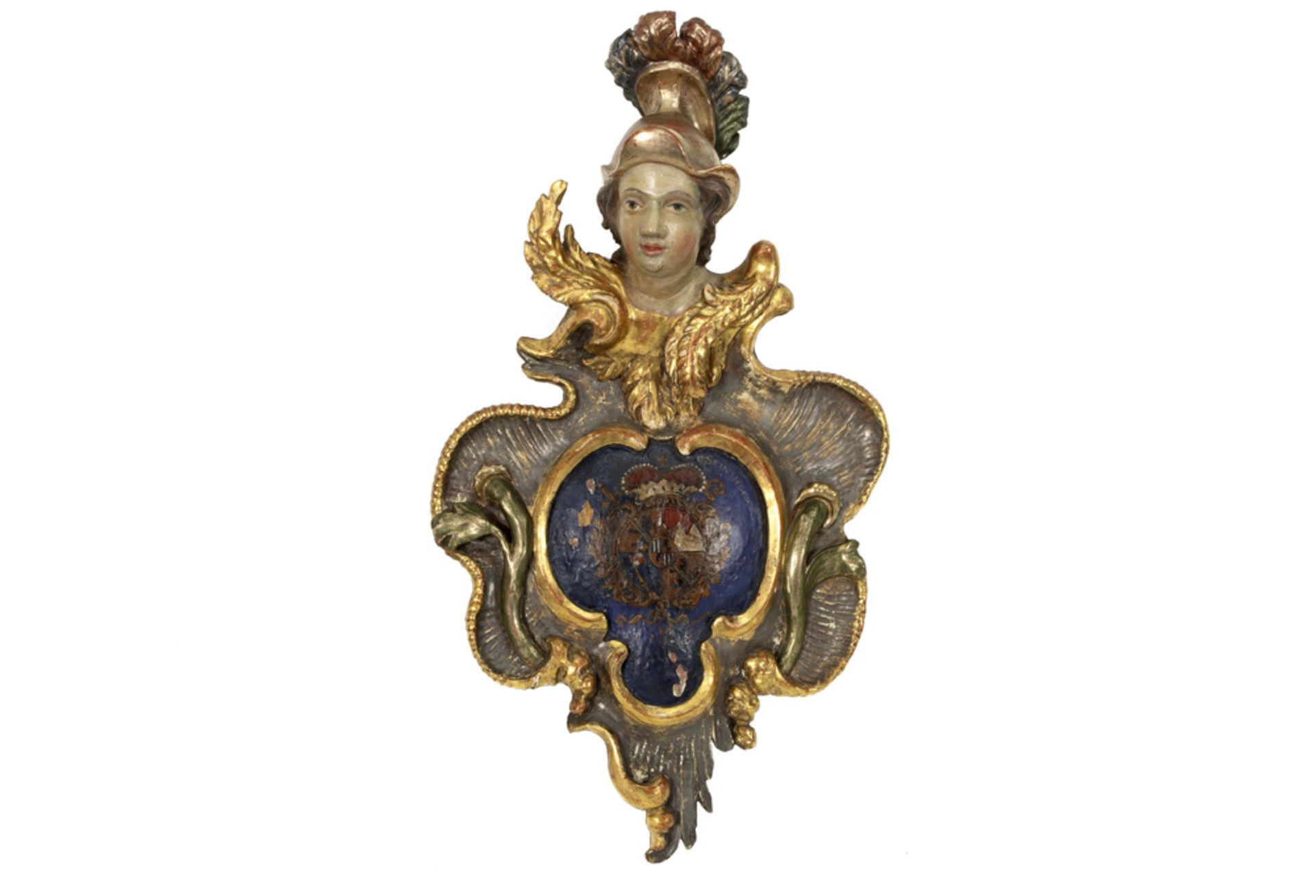 18th Cent. baroque style cartouche with on top a helmeted angel's head in sculpted wood with a