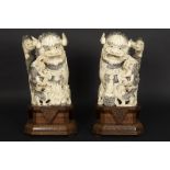 pair of antique Chinese Qing period sculptures in ivory with inlaid cabochons of several kinds of
