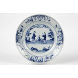 18th Cent. Chinese plate in porcelain with a blue-white decor with figures in a garden || Achttiende