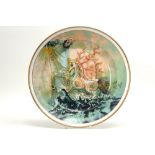 20th Cent. dish in marked porcelain with a surrealistic depiciton after S. Dali with on the back a