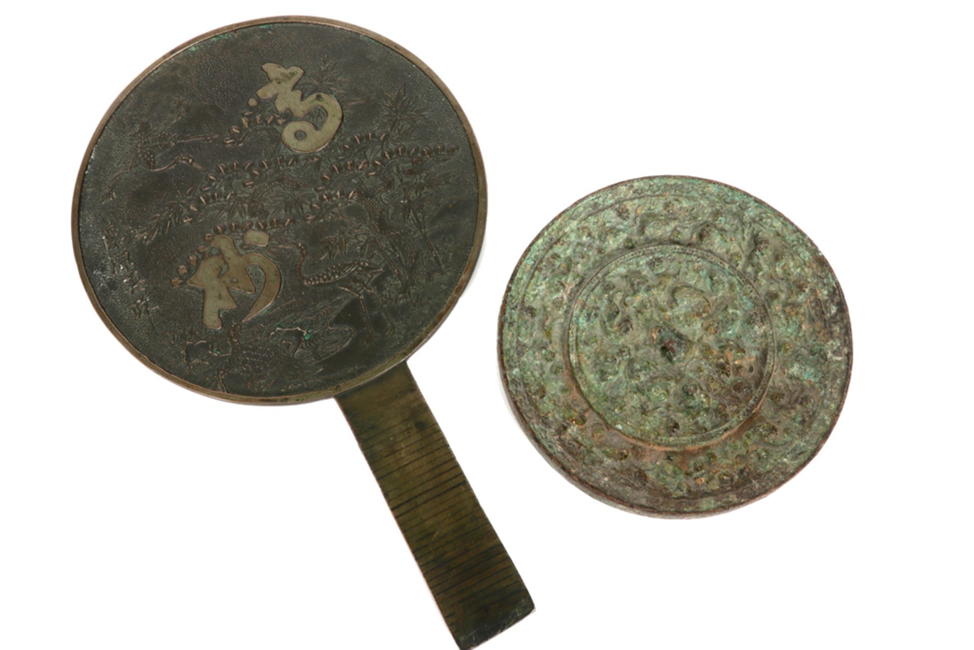 two Chinese mirrors : one in metal from the Qing period and one in bronze from the Han period || Lot