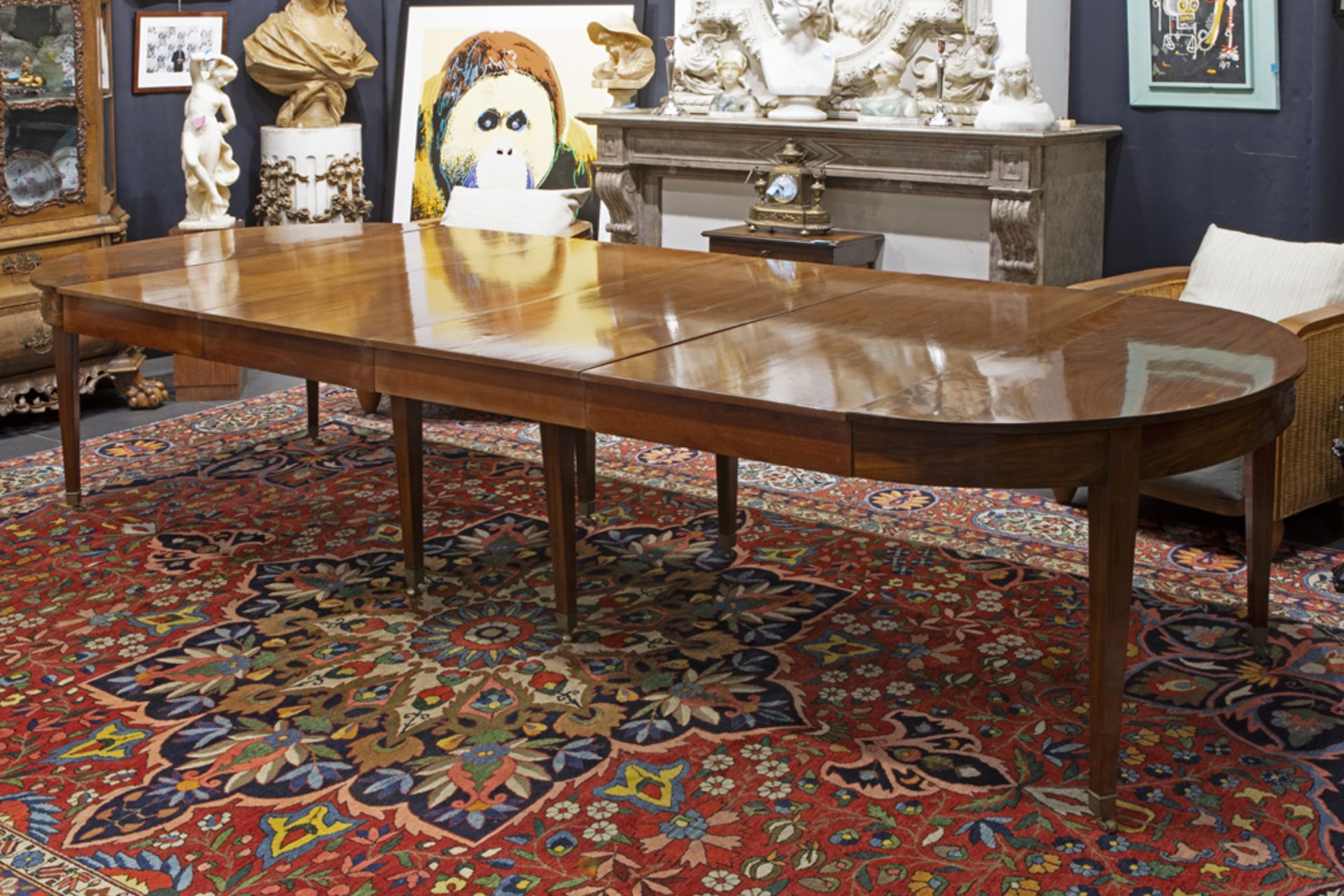 beautiful late 18th Cent. neoclassical table in mahogany with eight feet and with an oval extendable