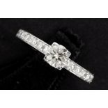 a 0,51 carat quality brilliant cut diamond set in a ring in white gold (18 carat) with ca 0,50 carat