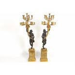 pair of quite big Empire style candelabra in partially gilded bronze each with a woman, who