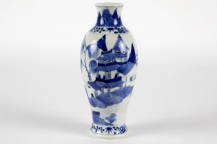 antique Chinese vase in Kang Hsi marked porcelain with a blue-white decor with an animated landscape