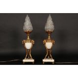 pair of 'antique' lamps each with a neoclassical lidded vase in marble and gilded bronze as