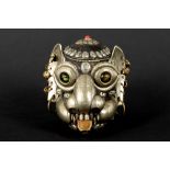 Nepalese tantric-buddhistic "cittipatti" sculpture with a monkey skull with a mounting in metal (