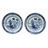 pair of 18th Cent. Chinese plates in porcelain with a blue/white decor with a vase in a garden ||