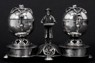 antique Polish salt cellar with two ovoid containers and a standing male figure - in "Warshau 84"