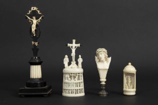 four small antique items in or with bone : a crucifix, two times a Calvary and a stamp with bust