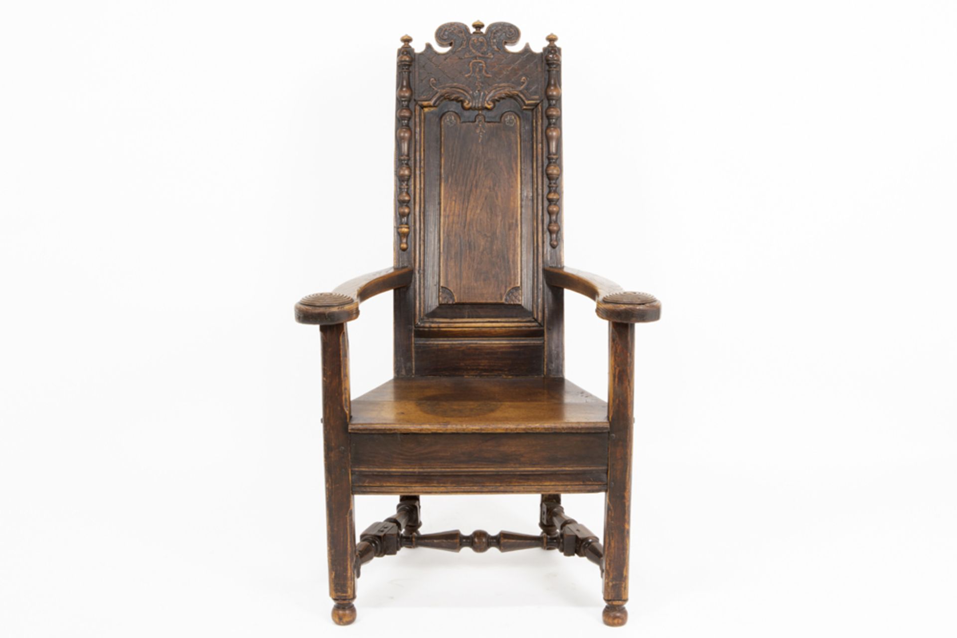 antique oak armchair with carved Régence ornamentation and dated 1766 on the back || Antieke