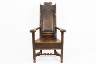 antique oak armchair with carved Régence ornamentation and dated 1766 on the back || Antieke