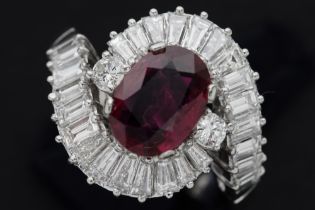 beautiful ring in platinum with a 1,72 carat oval ruby from Thailand or Cambodia surrounded by ca