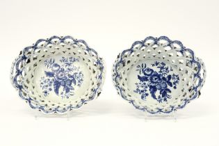 pair of 18th Cent. English Worcester marked baskets in open work ceramic with a blue-white flower